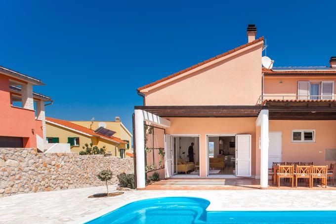 Villa Roza-Murter(Anfiteatro Adriatico,Villa Cherry,Villa Rosy Murter,Sea view house with pool Murter) is located on the island of Murter in a peaceful location with a great view over the sea.
The air distance of the house from the sea is 230 meters.
Villa Roza consists of ground floor, upper floor and an outdoor area.
In the outdoor area you can find a wonderful garden for guests to enjoy, with ecologically grown herbs and a garden with fruit and vegetables, a swimming pool,Jacuzzi for 5 persons and Sauna for 3 persons,  a small kitchen with barbecue and dining table, a perfect setting to relax, cool down and enjoy the summer time. The pool has an installed option for heating of the water and counter-swim device.
The villa is modernly decorated. On the ground floor there is a fully equipped kitchen, living room, one bedroom ( en-suite) with a private bathroom, and an additional bathroom.
The upper floor has a gym, three bedrooms and a shared bathroom with a jacuzzi for the whole floor. Each bedroom has its own terrace and provides you with a great view, either on the island of Murter, or over to the sea.

All rooms are equipped with SAT TV and safe deposit boxes.
There are no additional sofa beds in the common spaces.
There are 4 bedrooms, three of which have one double bed, and the fourth room has a bunk bed, accommodating 8 people in total.Guests have at their disposal a lot of things to keep them active during their stay,like bikes,table tennis darts,table football.After active day they have Jacuzzi or sauna to relax.
Smoking is not allowed in the house.
Pets are not allowed in the house.
Baby cot available on request.
Air conditioning, private parking,washing machine and free WiFi provided.
Pool, garden and outdoor areas maintained daily by the owners who lives in secluded apartment on site.All cleaning and maintenance performed from 5 am to 7 am.Privacy of the guests guarantied.

A mandatory law requires every guest have to present valid government ID upon check-in, persons other than registered guests are restricted from the check in.
Parties are not allowed 
Pets are not allowed

